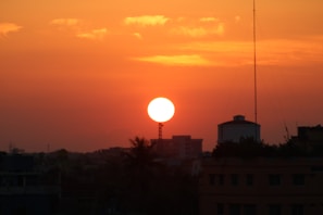 A vibrant sunset over a bustling urban landscape.