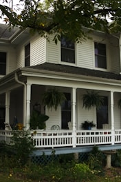 A cozy family home with a welcoming front porch and garden.