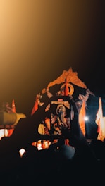 A devotee using a smartphone to book archana through the anugraha app.