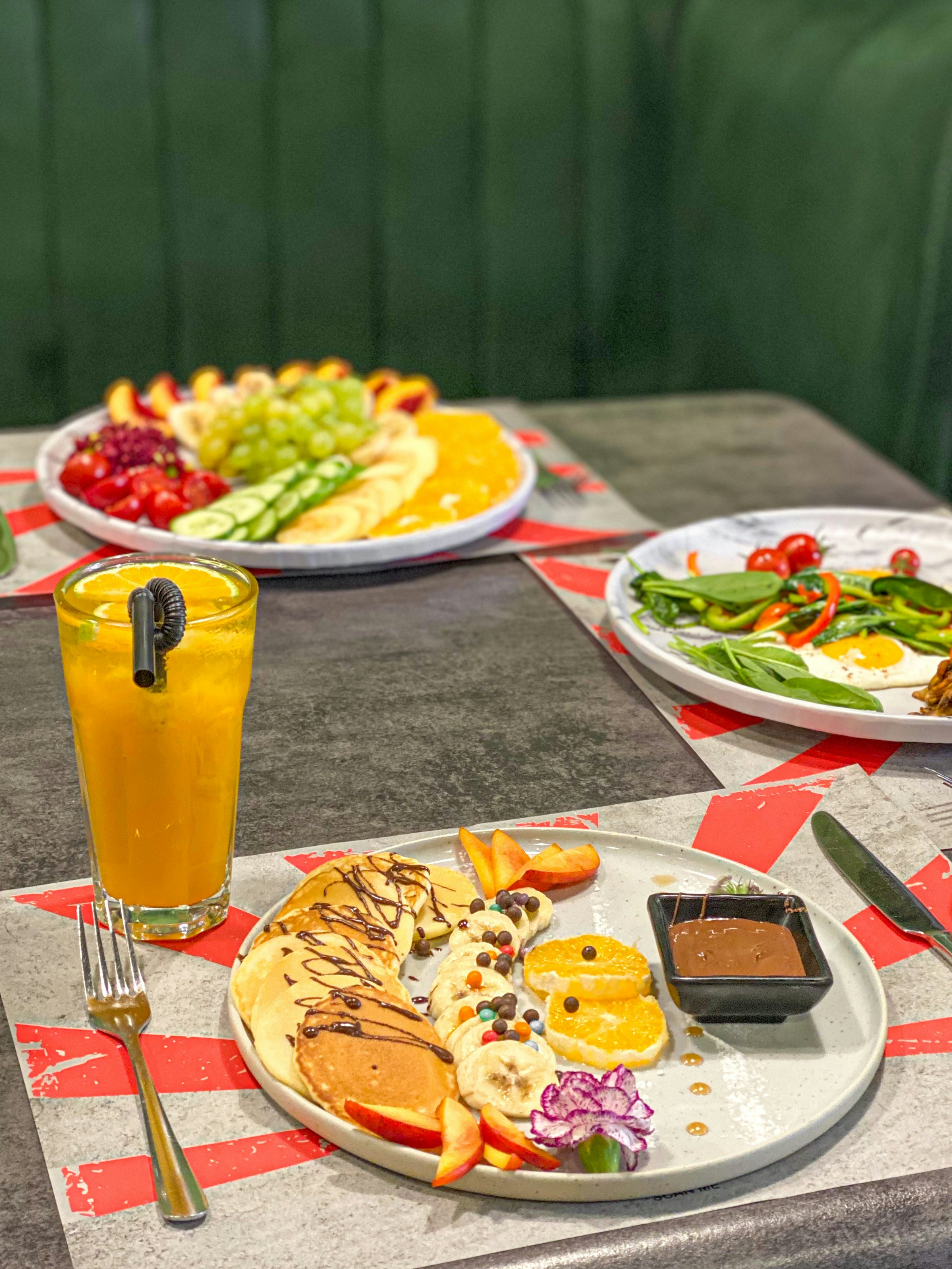 a table topped with plates of food and drinks