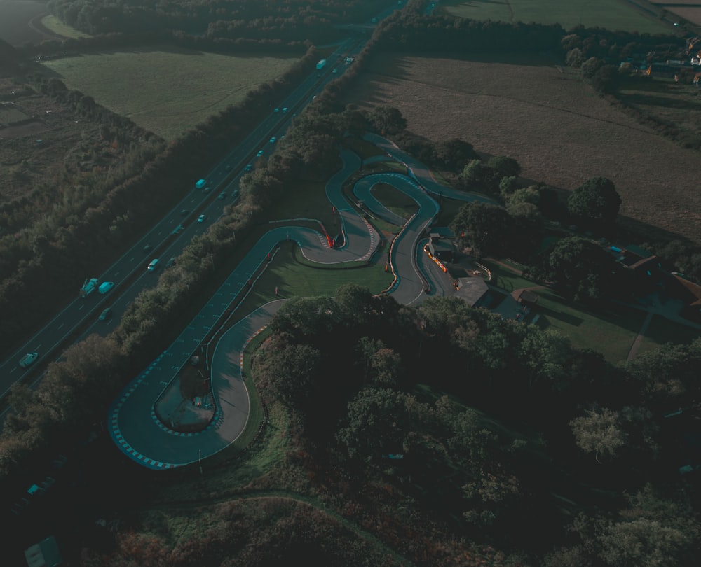 an aerial view of a winding road in the countryside