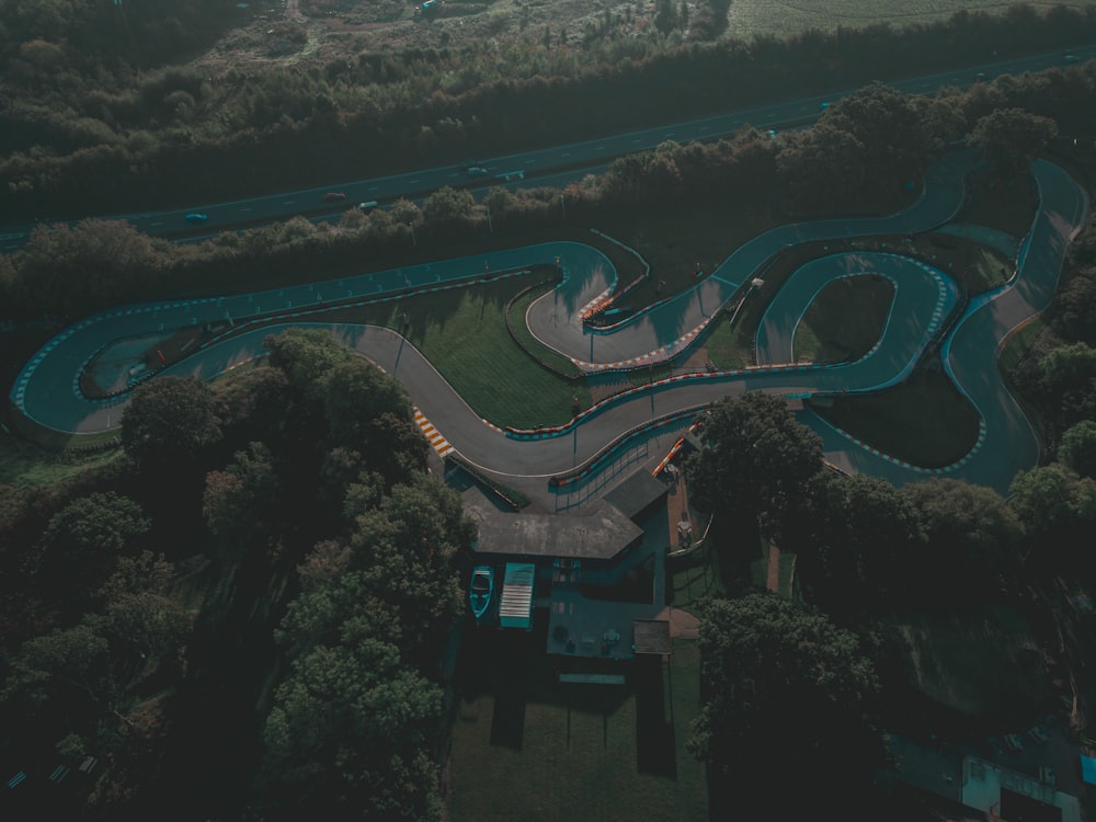 an aerial view of a winding road in the countryside