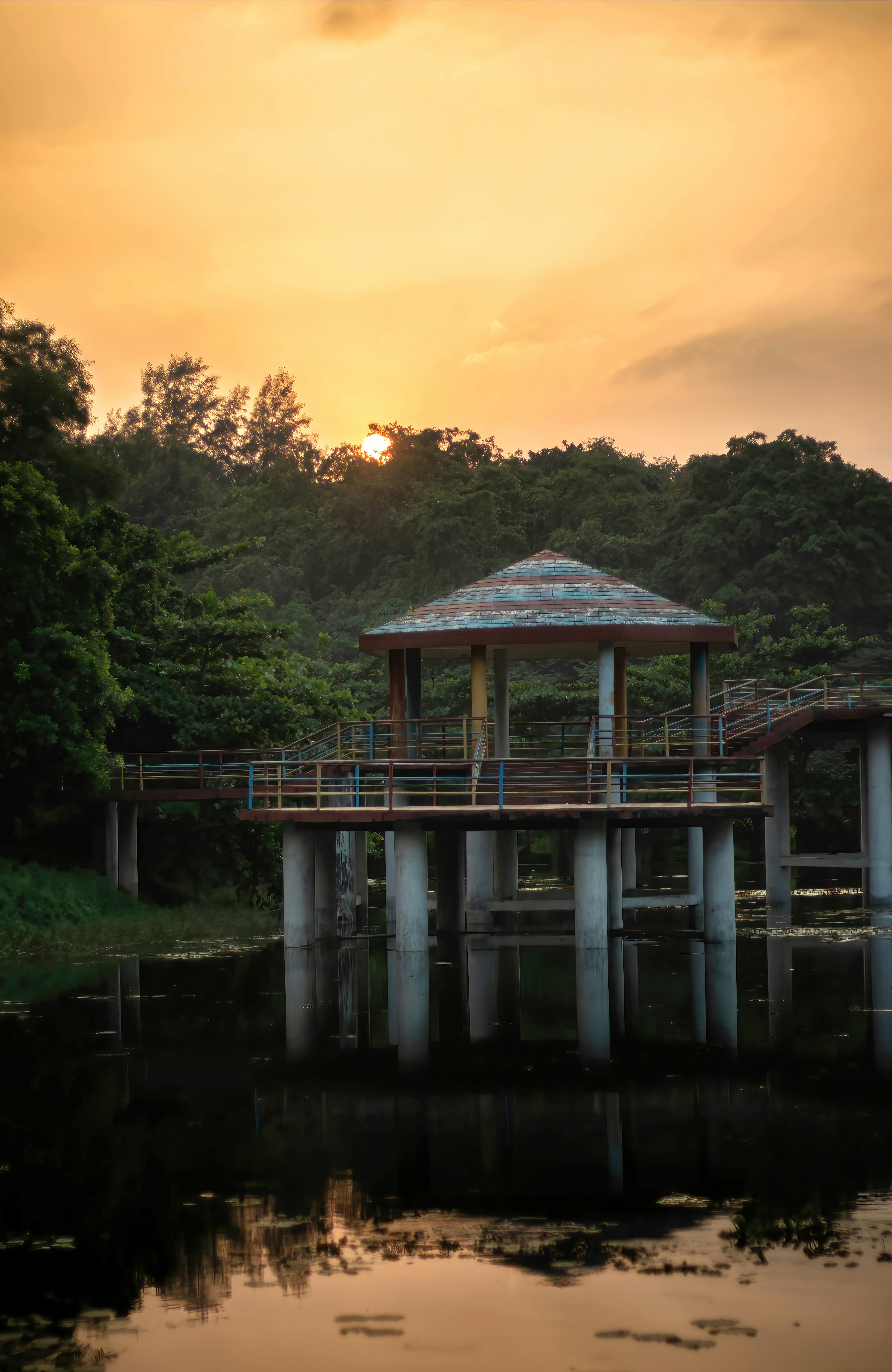 a gazebo sitting on top of a wooden pier