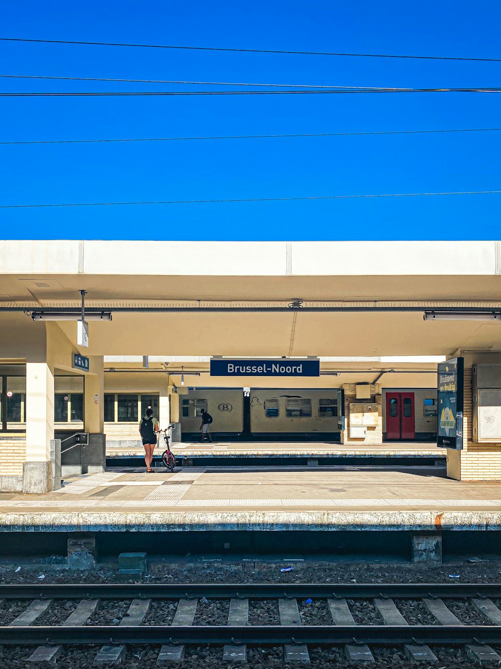 a train station with a train on the tracks