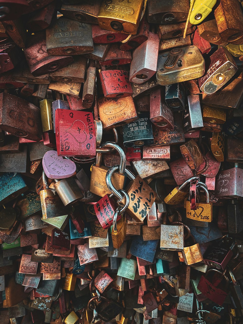 a bunch of padlocks are stacked on top of each other