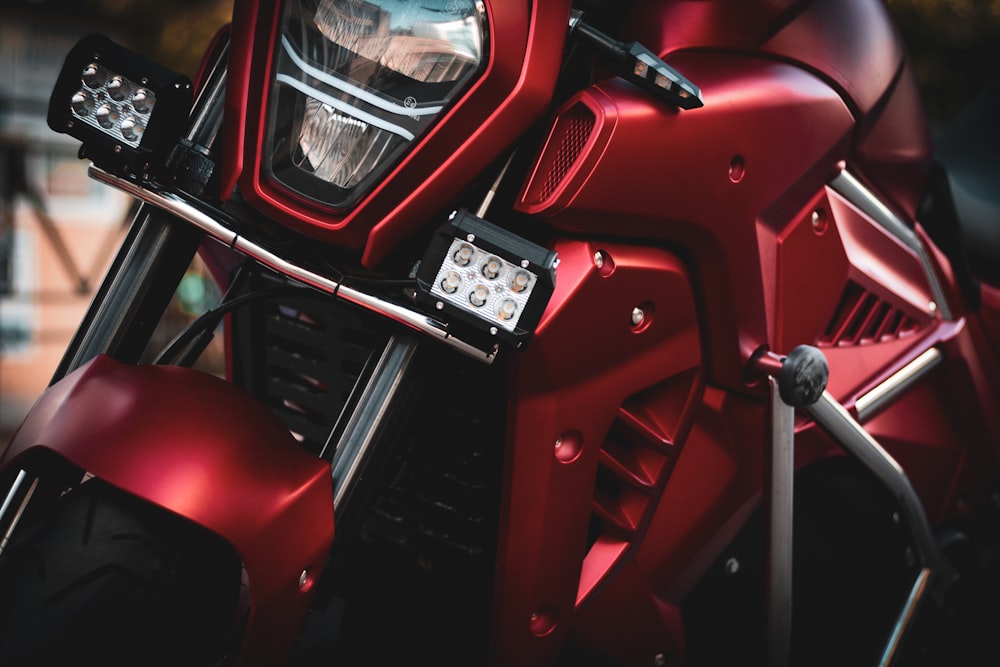 a close up of a red motorcycle headlight