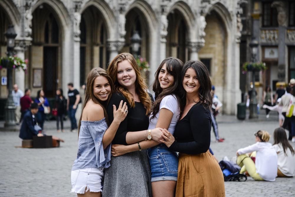 a group of young women standing next to each other