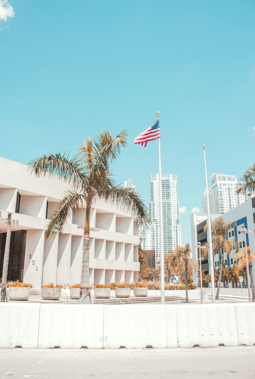 an american flag flying in front of a building