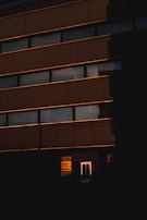 Exterior shot of the building at sunset with company sign visible