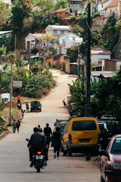 a group of people riding bikes down a street