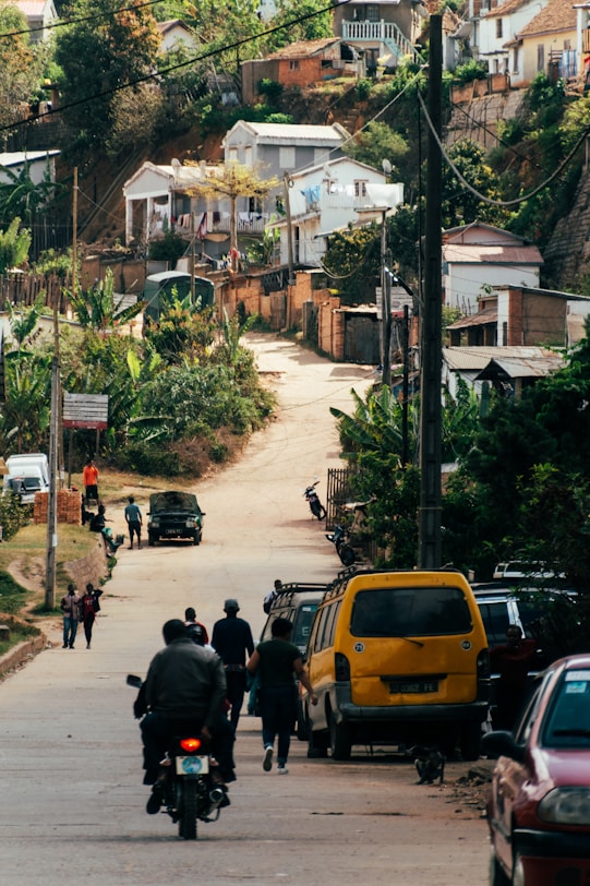 a group of people riding bikes down a street