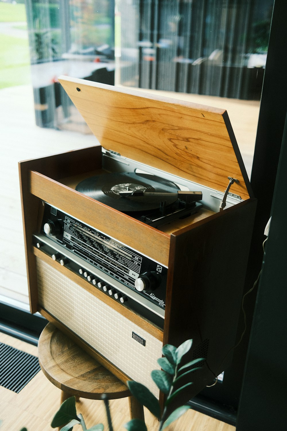 a record player sitting on top of a wooden table