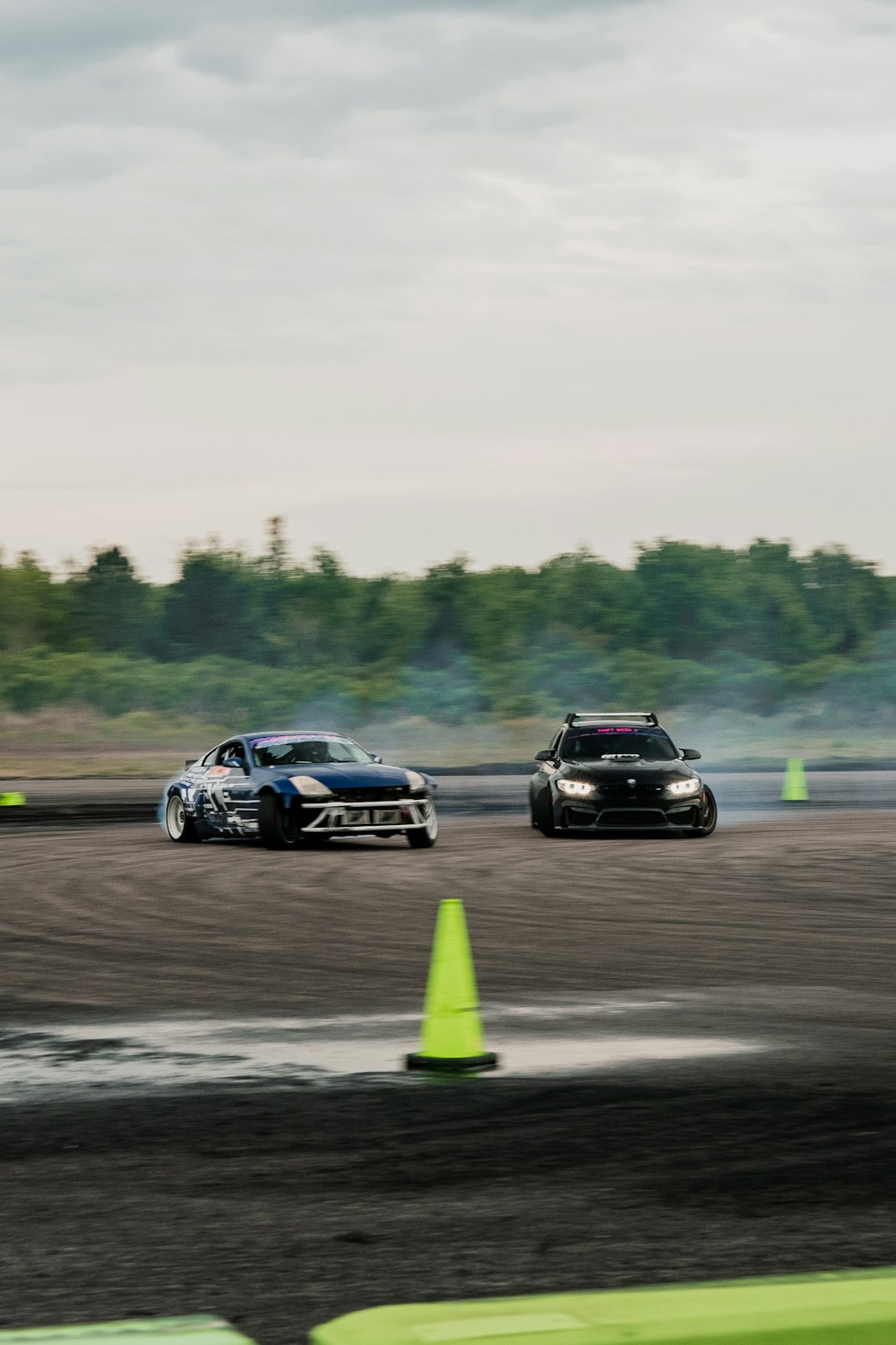 a couple of cars that are sitting in the dirt