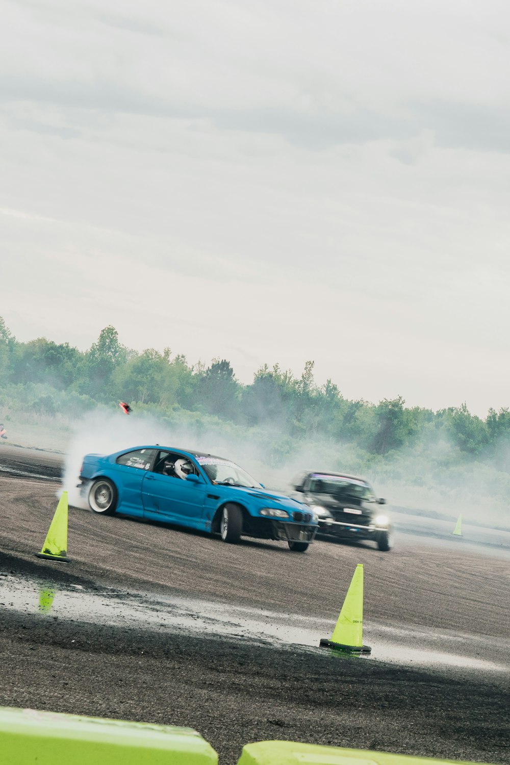 a couple of cars that are in the dirt