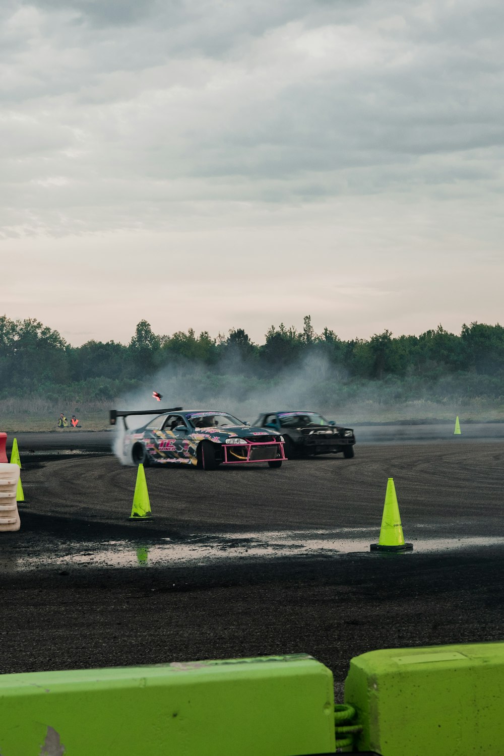 a couple of cars that are sitting in the dirt