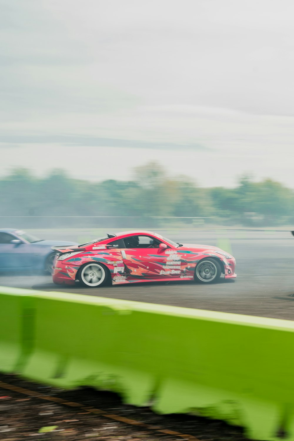 a couple of cars that are sitting in the dirt