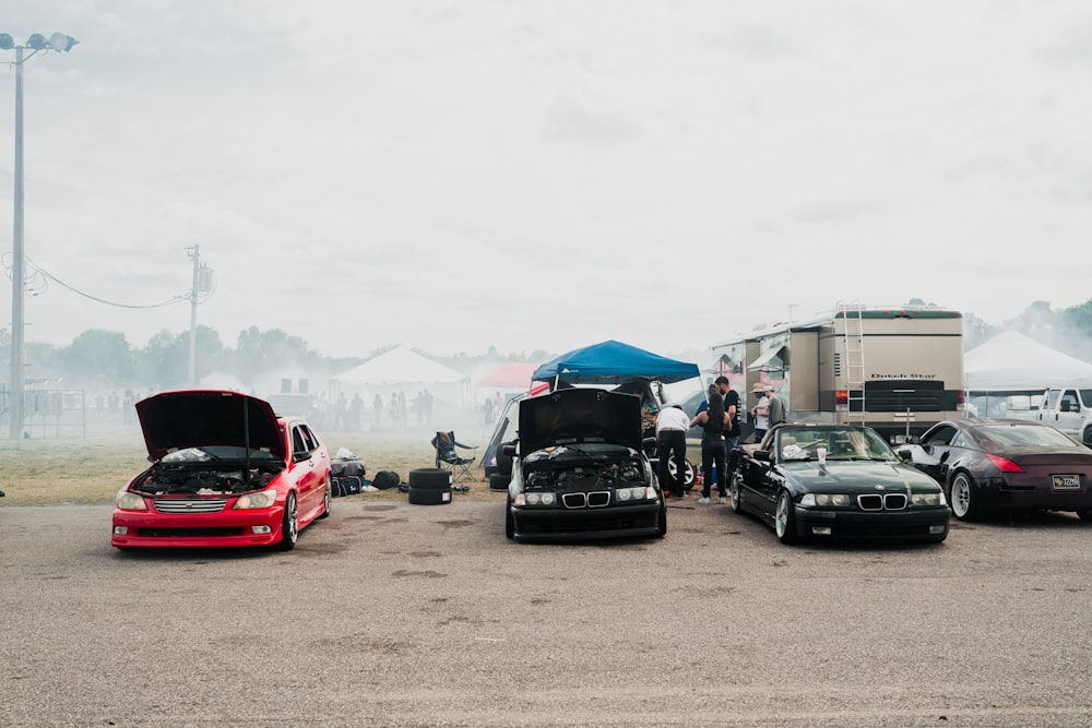 a group of cars parked next to each other in a parking lot