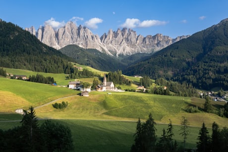The Dolomites - Val di Funes' church framed by the Odle range