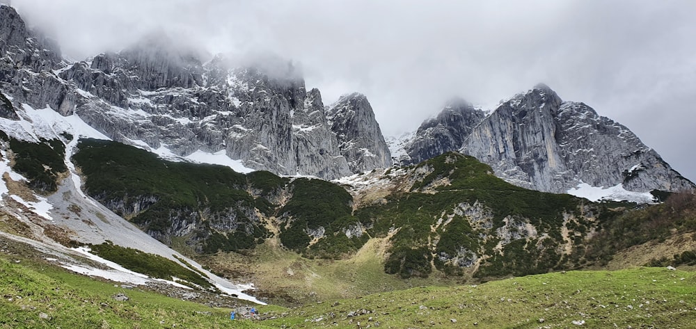 a group of people hiking up the side of a mountain