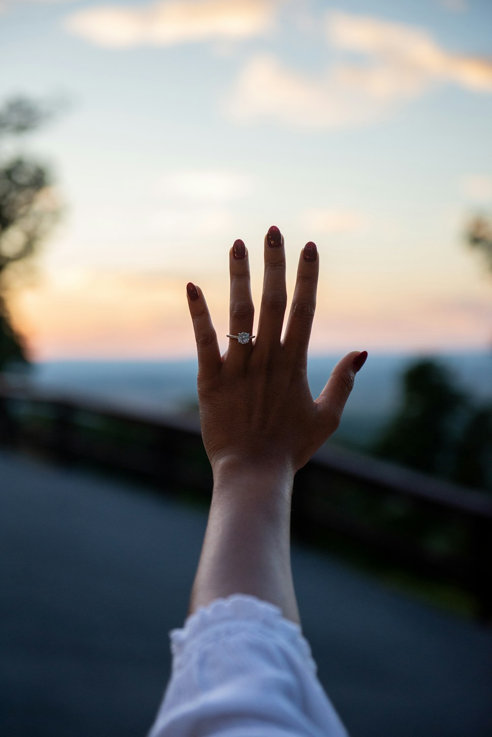 a woman's hand with a ring on it