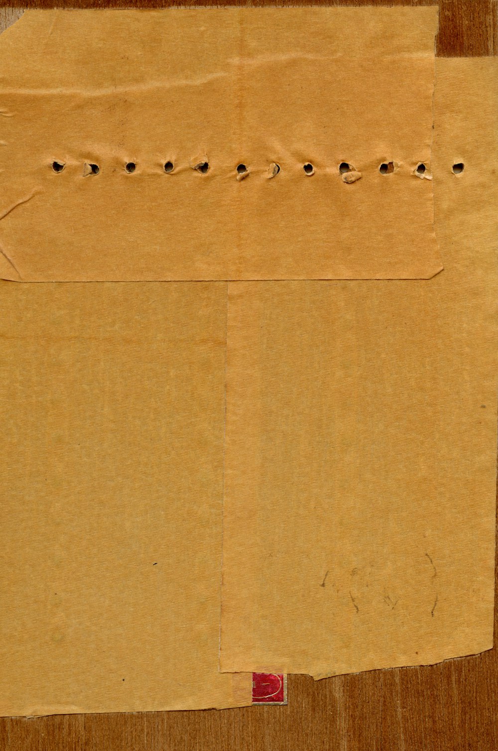 a piece of brown paper with writing on it