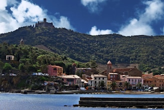 a small town on a hill overlooking a body of water