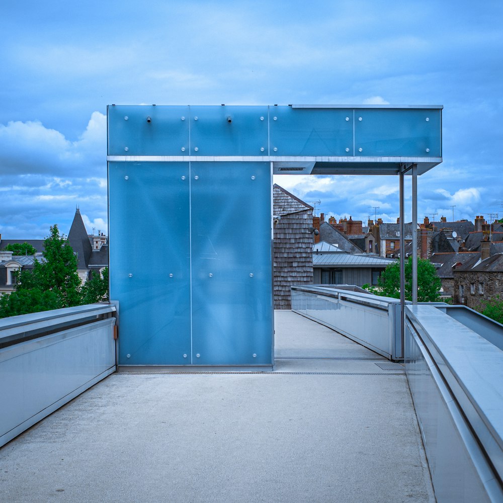 a blue metal structure on top of a building
