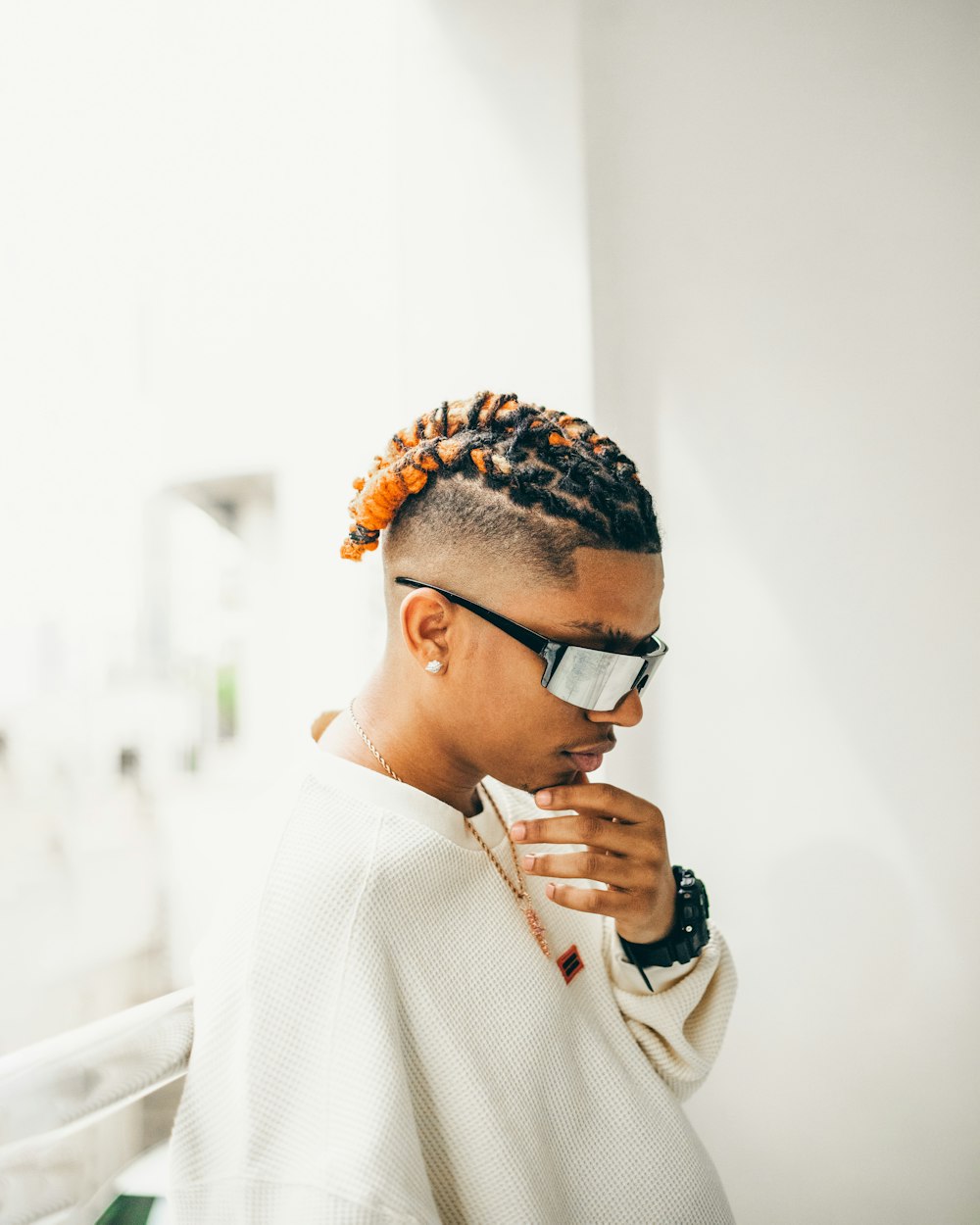 a woman with a pair of sunglasses on her head