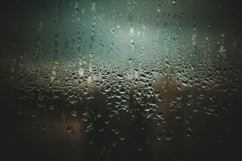 rain drops on a window with a blurry background