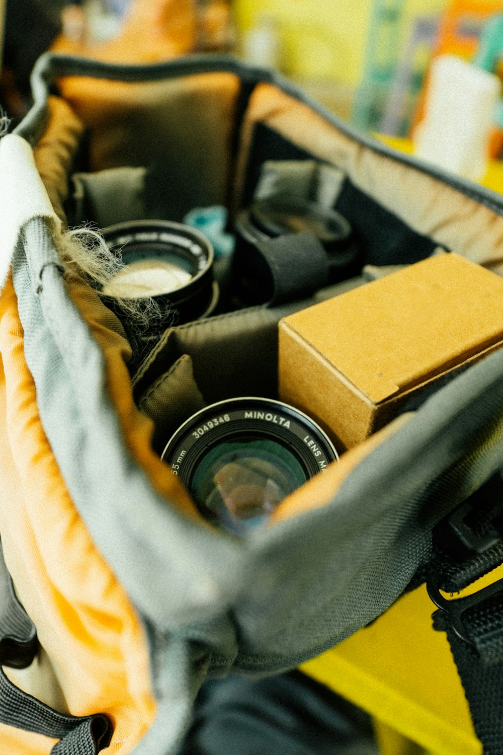 a camera inside of a bag with other items inside of it