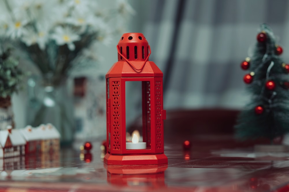 a red lantern sitting on top of a table