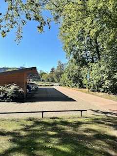 Quiet parking area near the studios, surrounded by greenery and easy access.