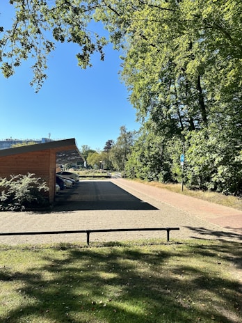 Quiet parking area near the studios, surrounded by greenery and easy access.