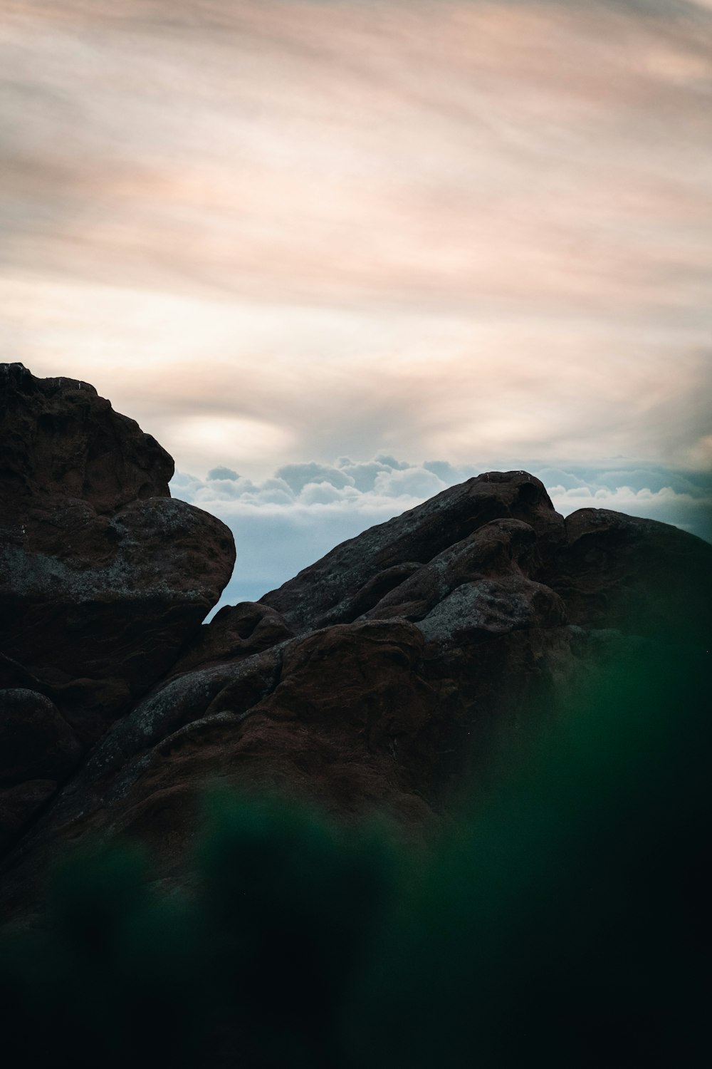 a person standing on top of a large rock