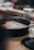 A cozy kitchen scene with a cast iron skillet sizzling on the stove.