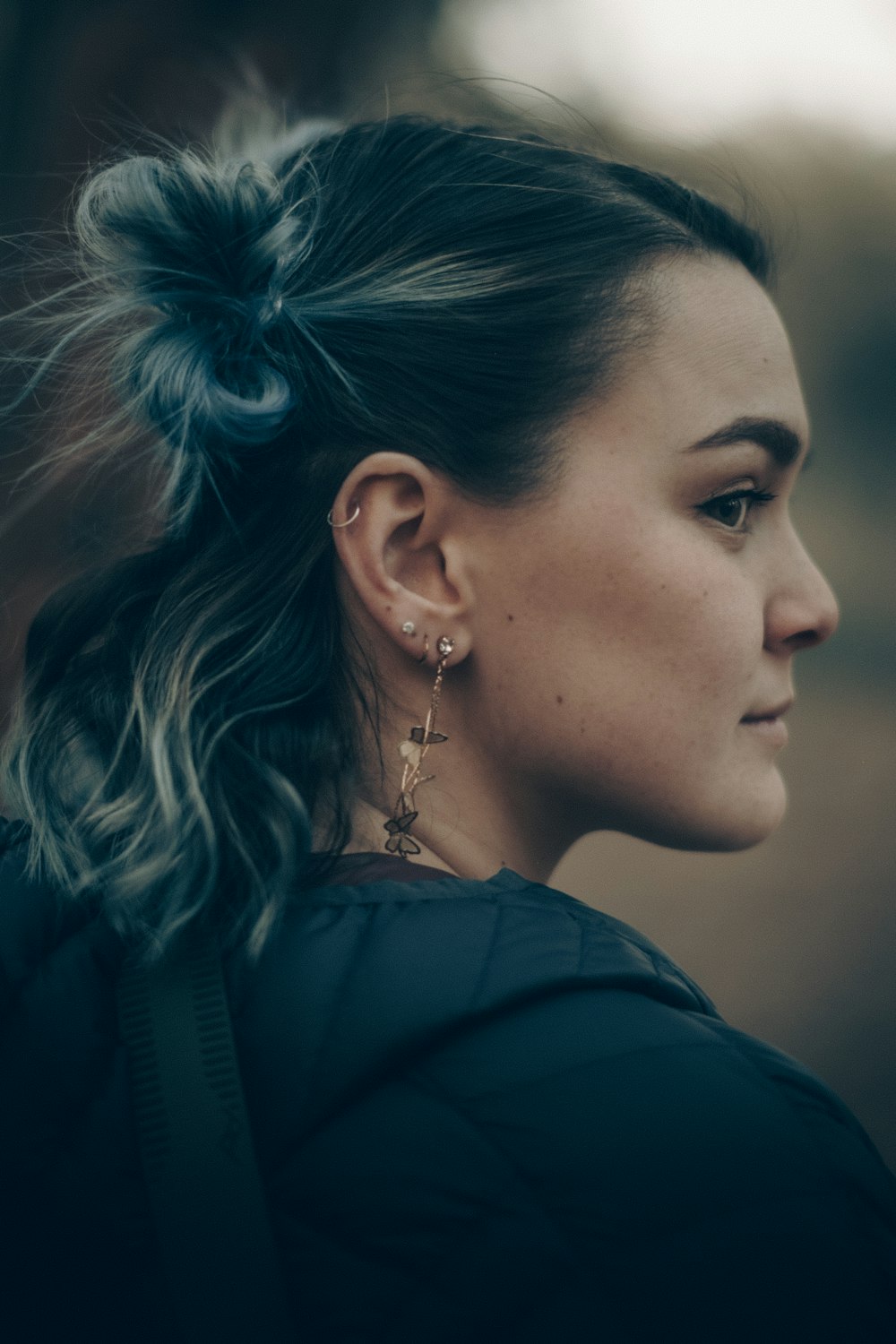 a woman with a ponytail in her hair