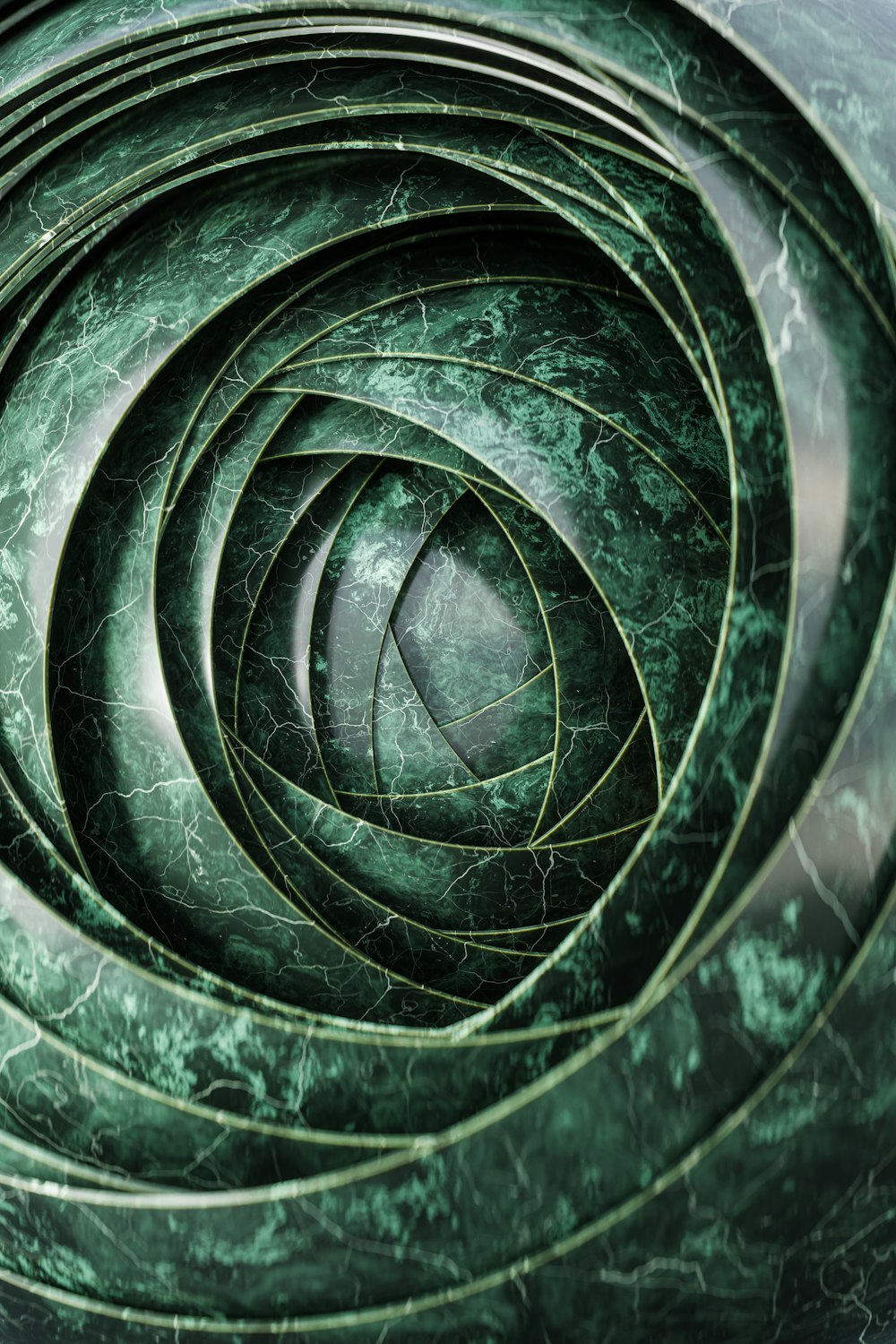a close up of a spiral of green marble