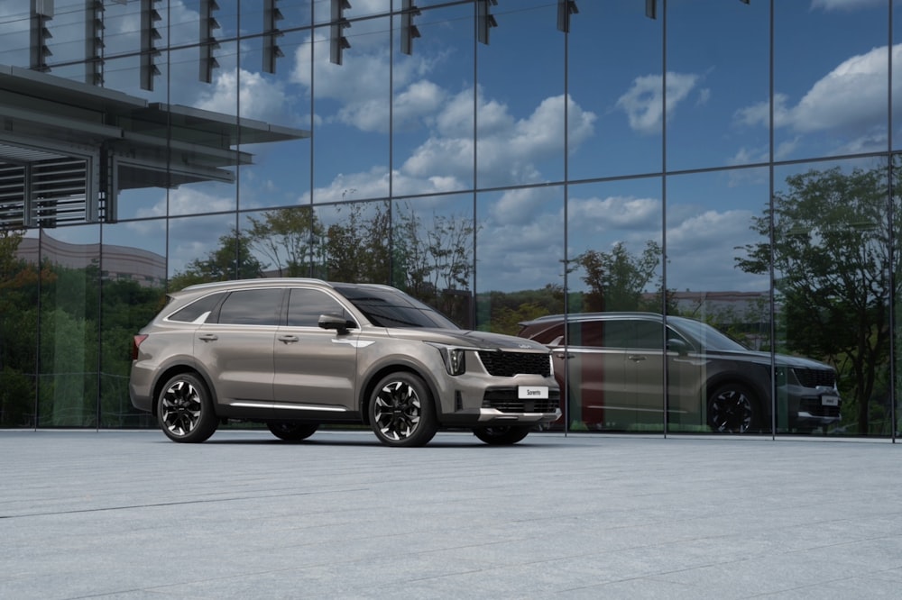 a silver car parked in front of a building