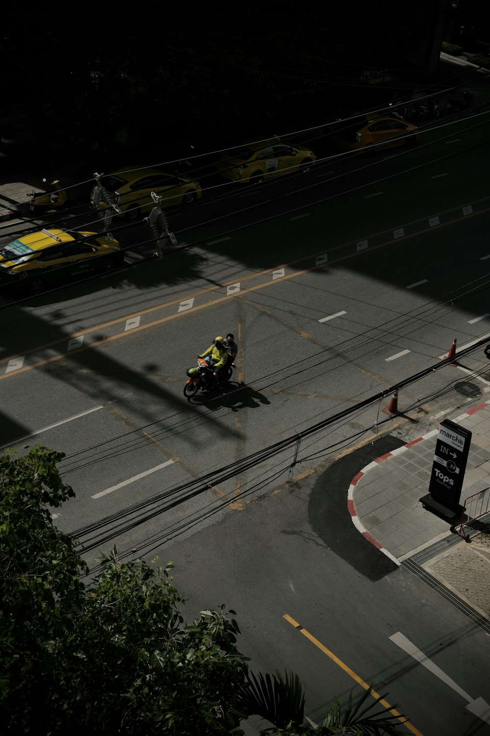 a person riding a motorcycle on a city street