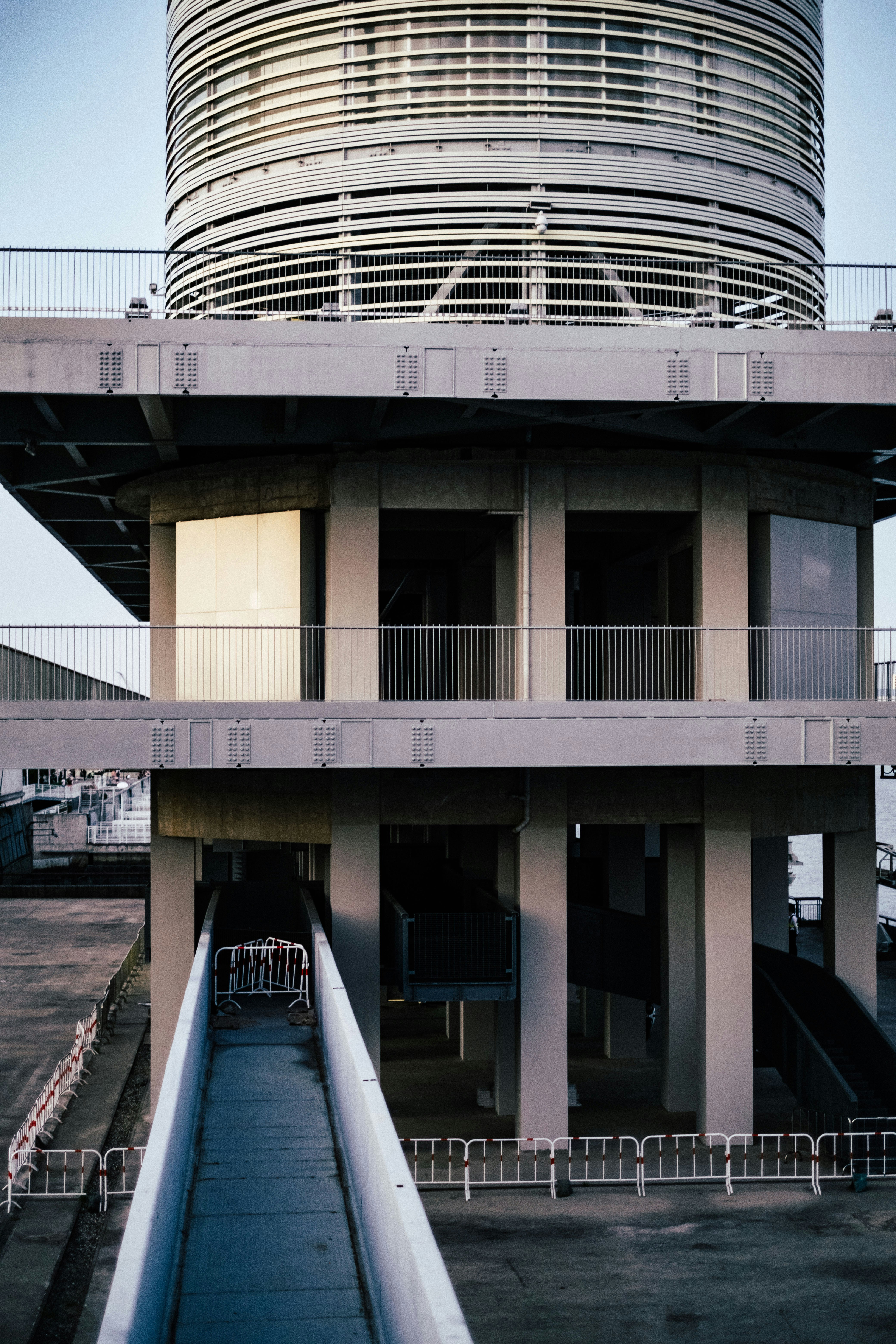a tall building with a very large round structure on top of it