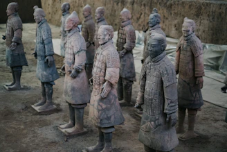 a group of statues of men standing next to each other