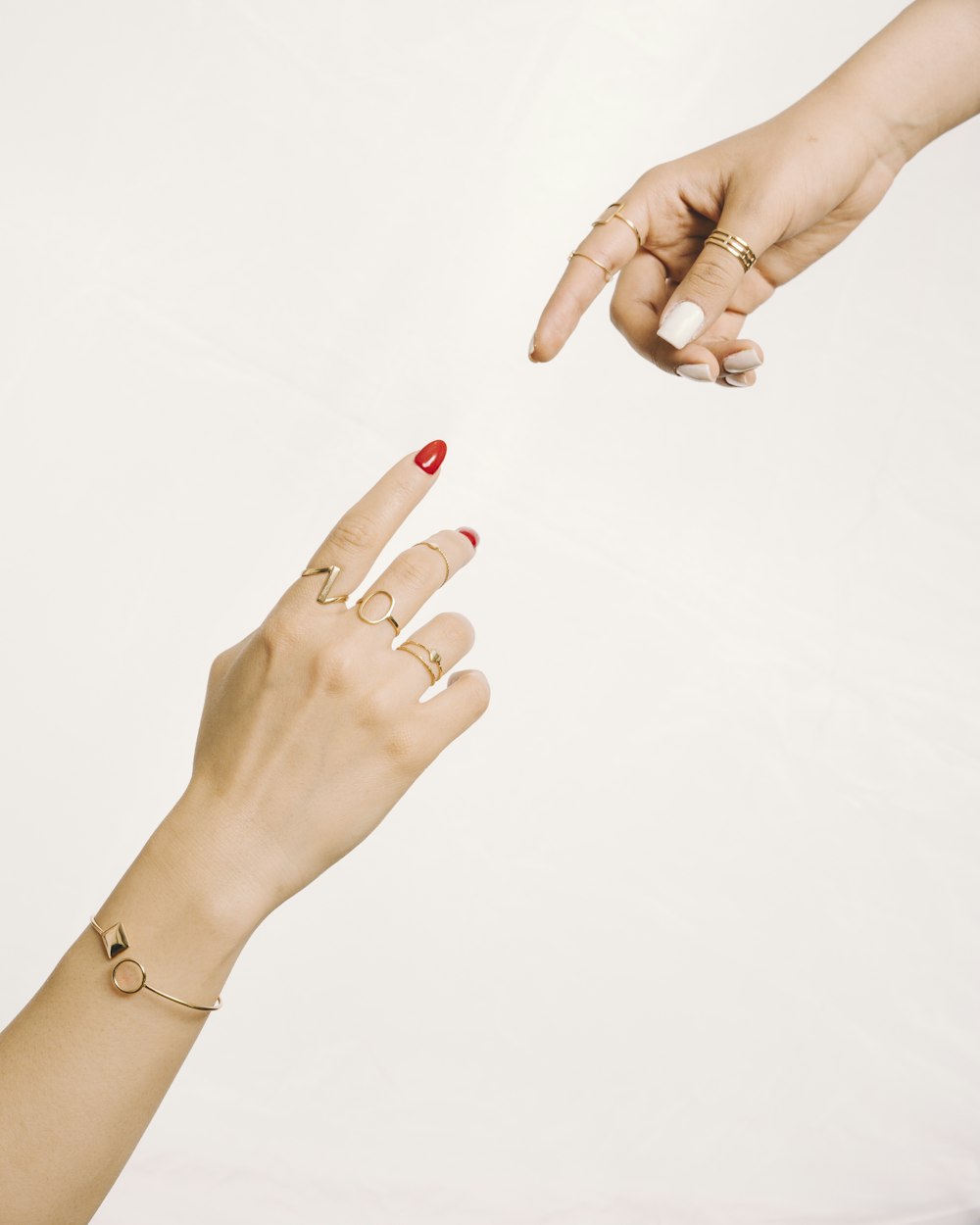 a woman's hand reaching for another woman's hand