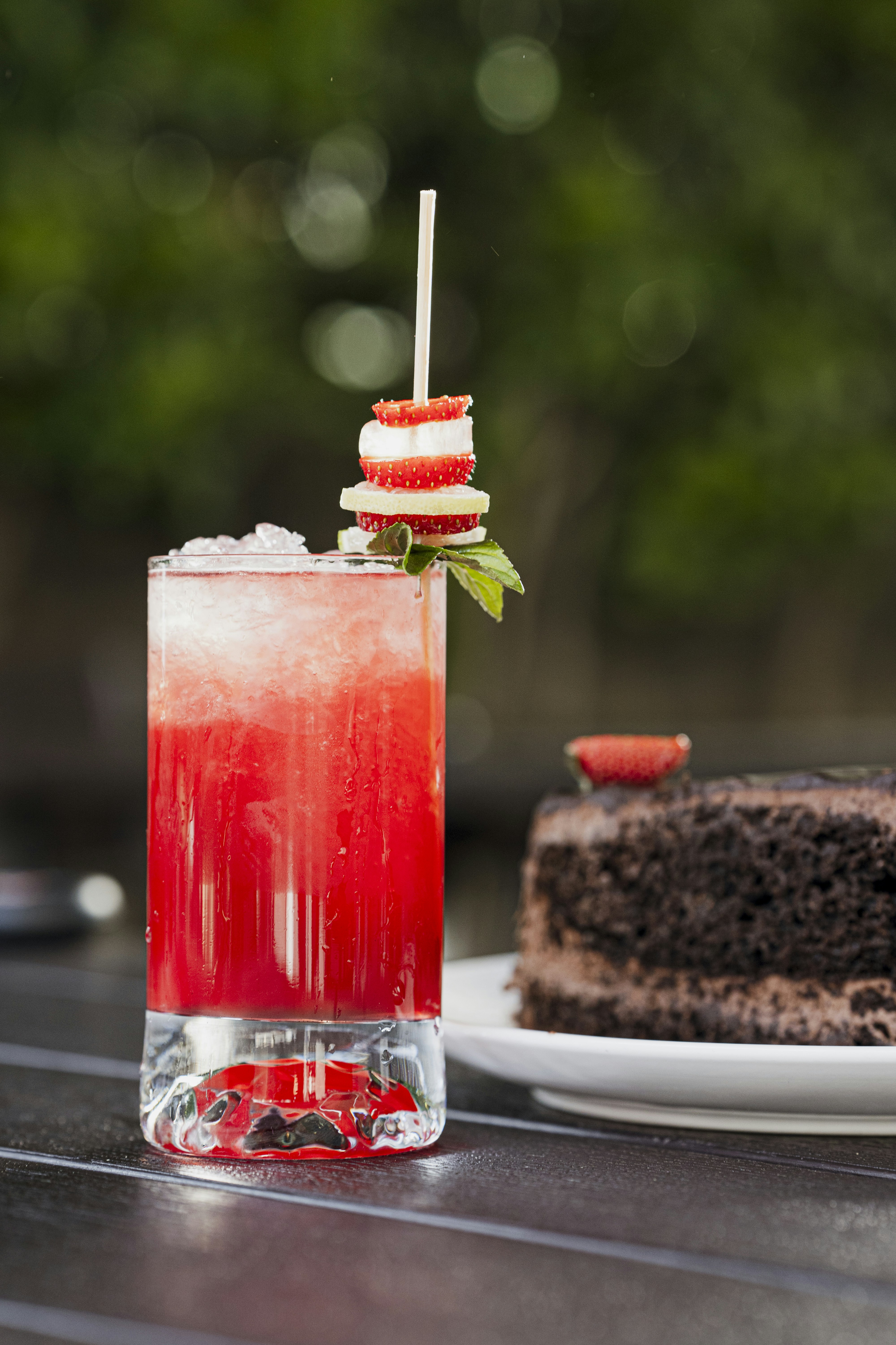 A slice of cake and a drink on a table photo Free Food presentation