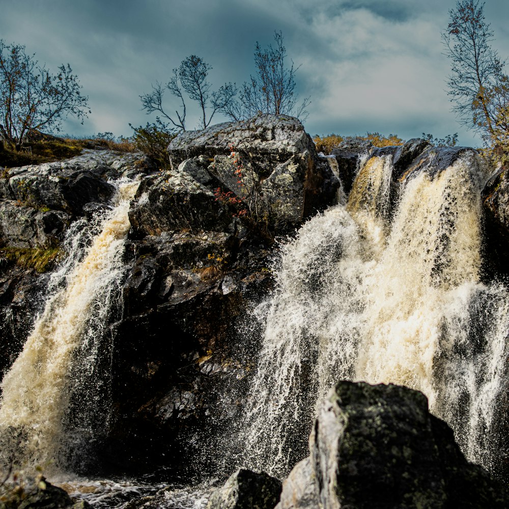 a large waterfall with lots of water coming out of it