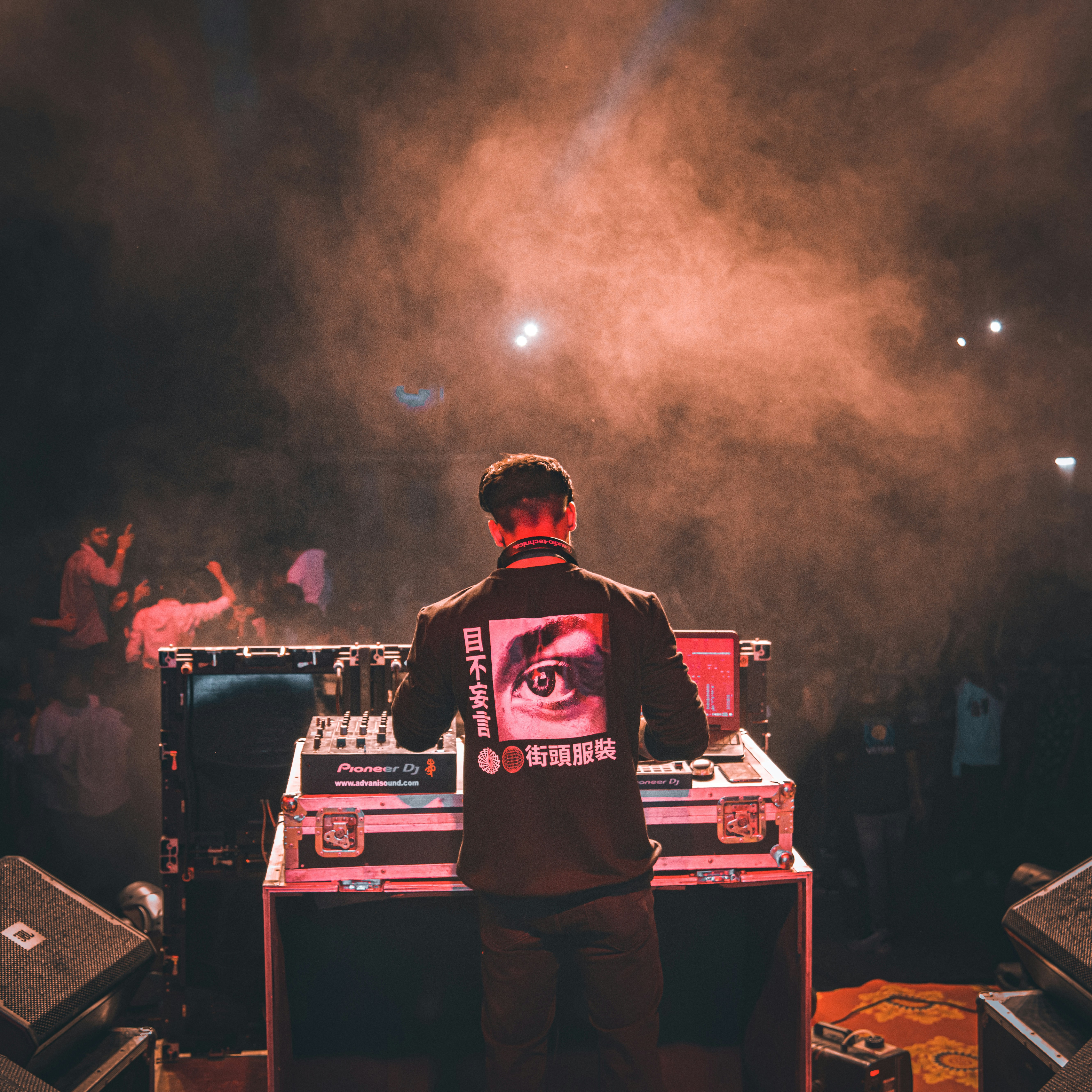 a man standing in front of a dj set