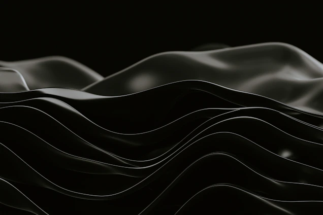 A minimalist, elegant sound wave gently flowing over a dark, textured background.