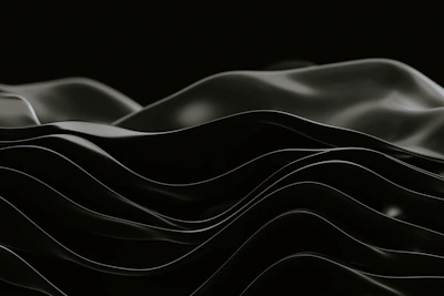 Subtle black Atlantic imagery blending waves and musical notes in deep, rich tones.