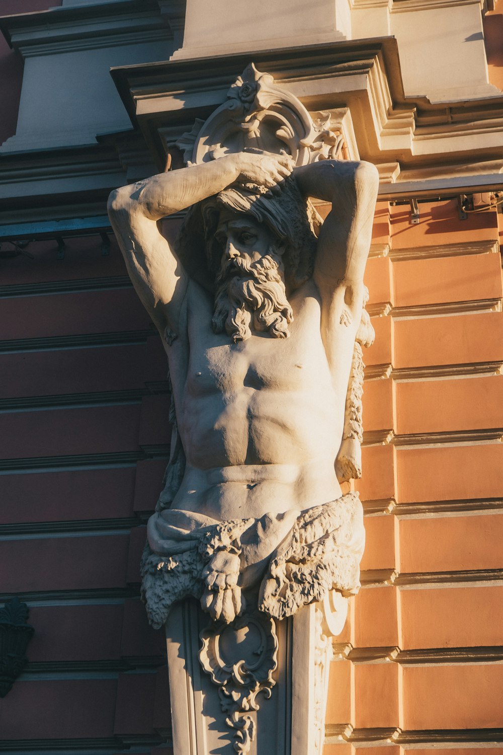 a statue on the side of a building