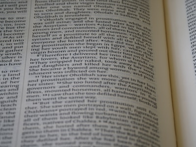 Close-up of hands holding a copy of the 'discours des martyrs' text.