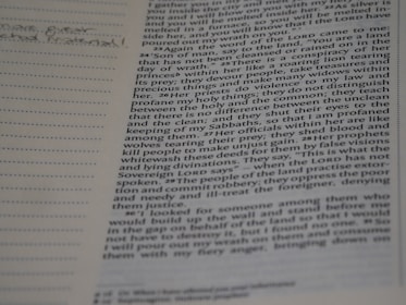 Close-up of hands writing notes during a theology class.